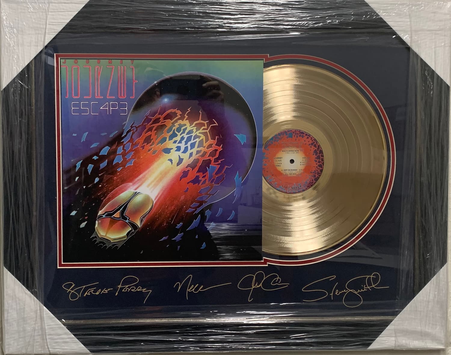 Framed gold record displayed beside the Journey album cover with a laser-reproduced signature, offered as a charity auction lot