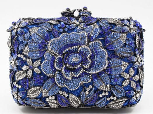 Hard-case clutch covered in blue and clear Swarovski crystals arranged as a large rose with leaves, a charity auction lot