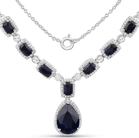 Sterling silver necklace of dark blue dyed sapphires, each framed in white topaz, with a pear-shaped sapphire drop, a charity auction lot