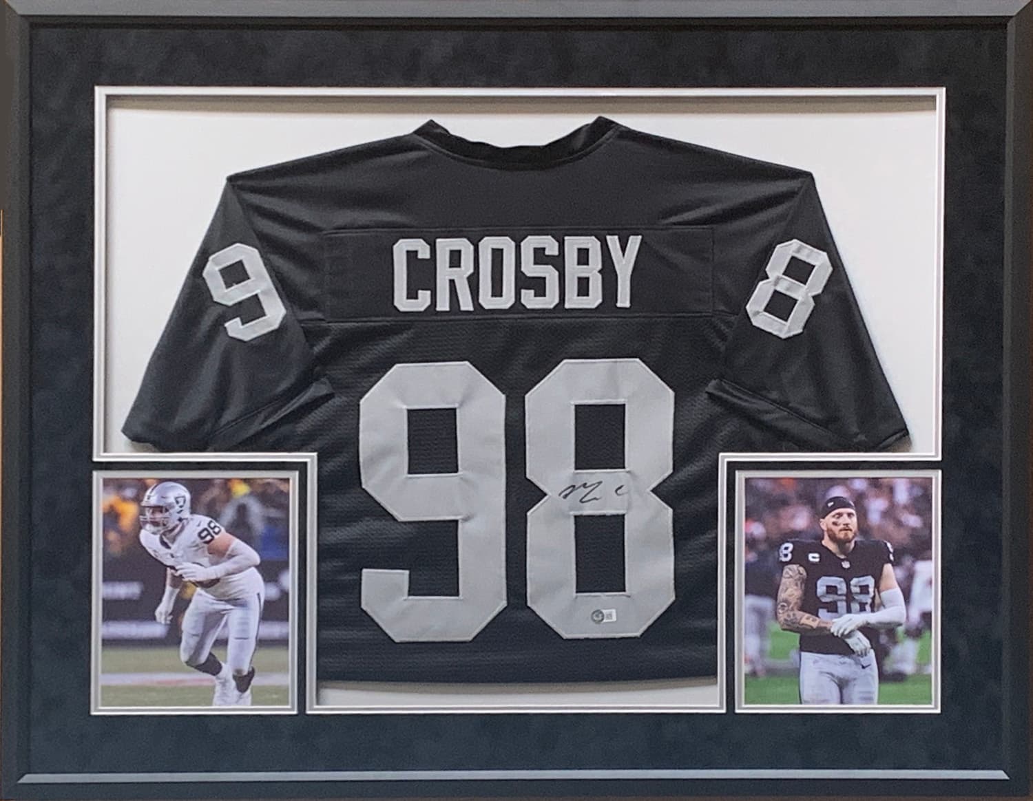 Black and silver Las Vegas Raiders jersey hand-signed by Maxx Crosby, framed with action photographs, offered as a charity auction lot