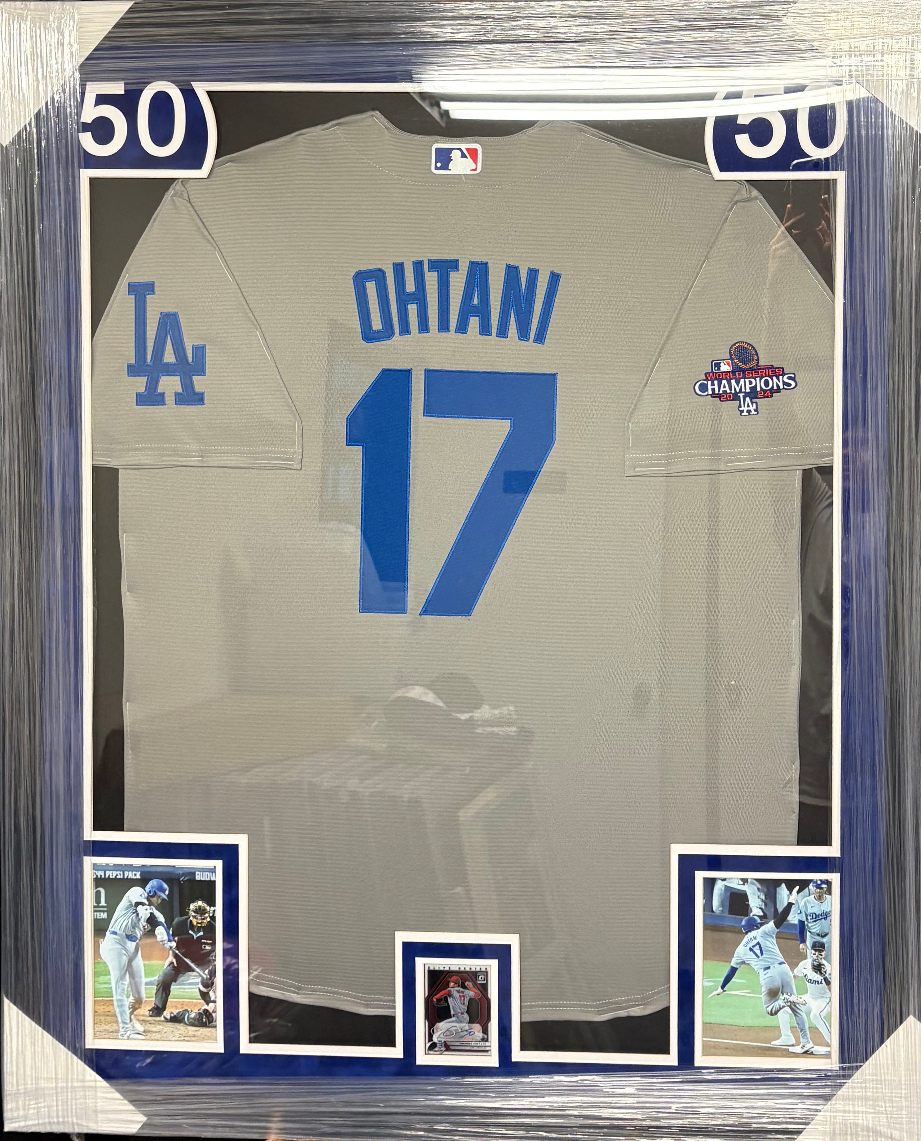 White Los Angeles Dodgers Ohtani jersey framed together with a hand-signed card, offered as a charity auction lot