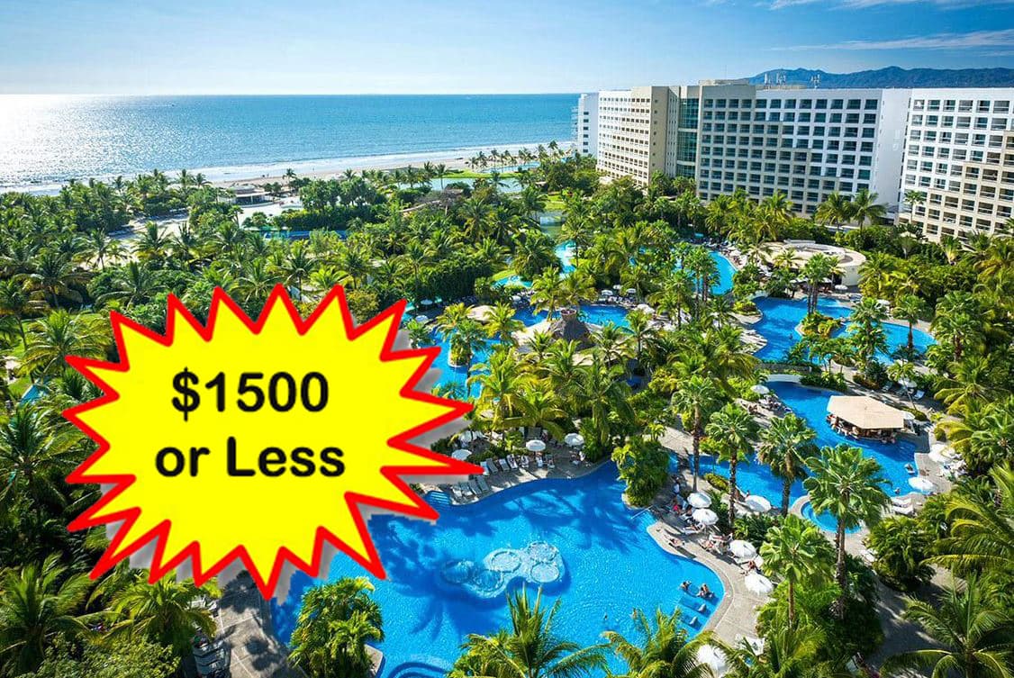 Aerial view of a large Mexican resort pool complex, representing the Mayan luxury resort auction package