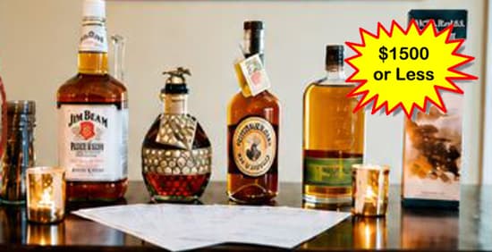 Bottles of premium whiskey and filled tasting glasses, representing the spirits tasting experience auction lot