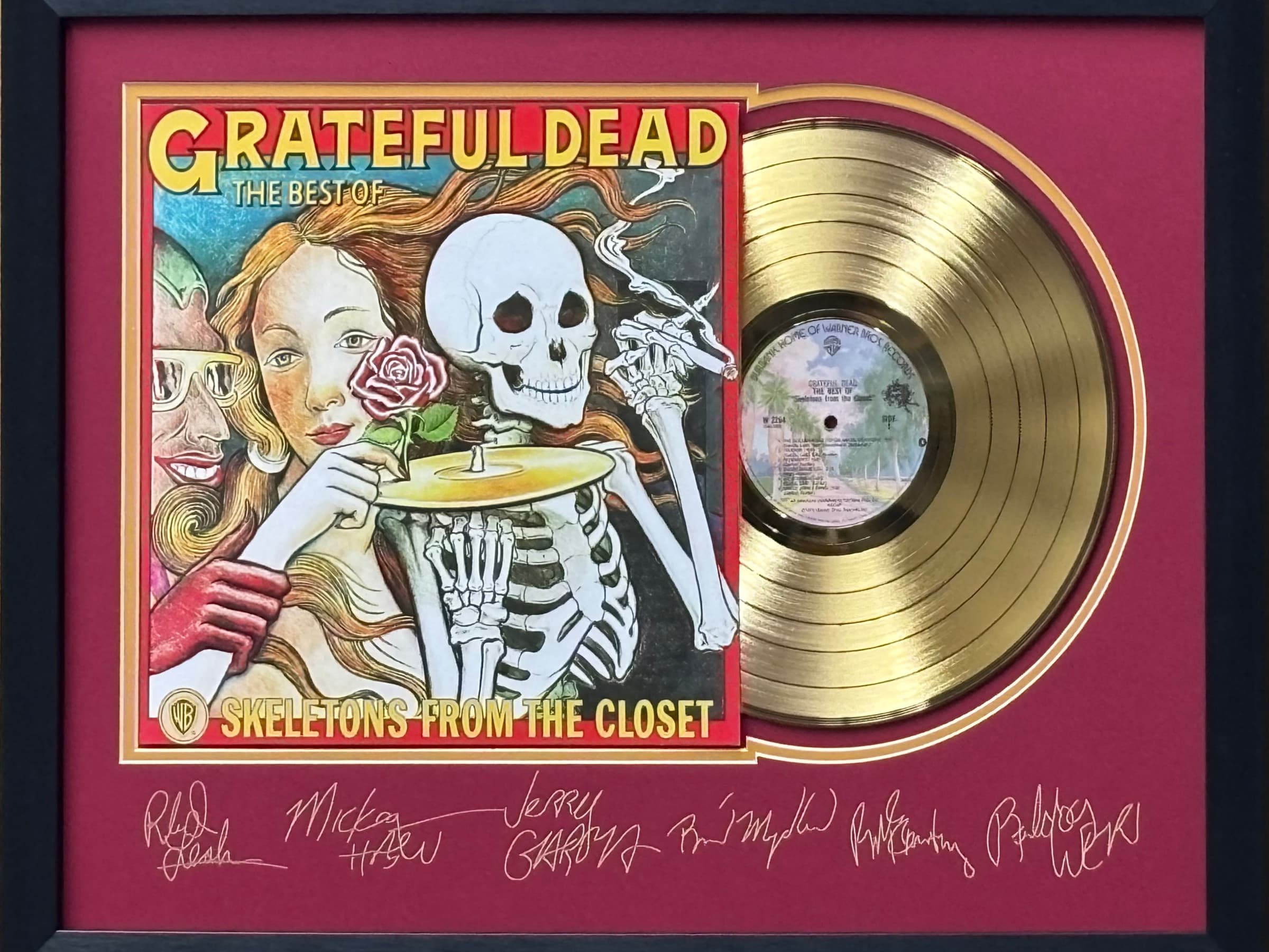 Framed gold record displayed beside the Greatful Dead album cover with a laser-reproduced signature, offered as a charity auction lot.